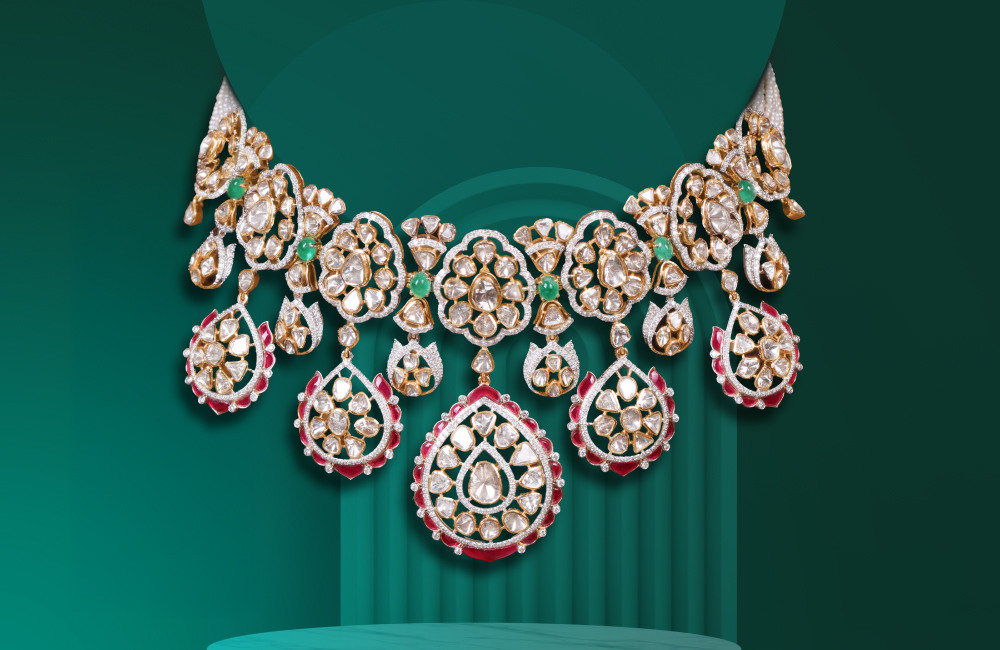 Diamond and emerald necklace set on green background